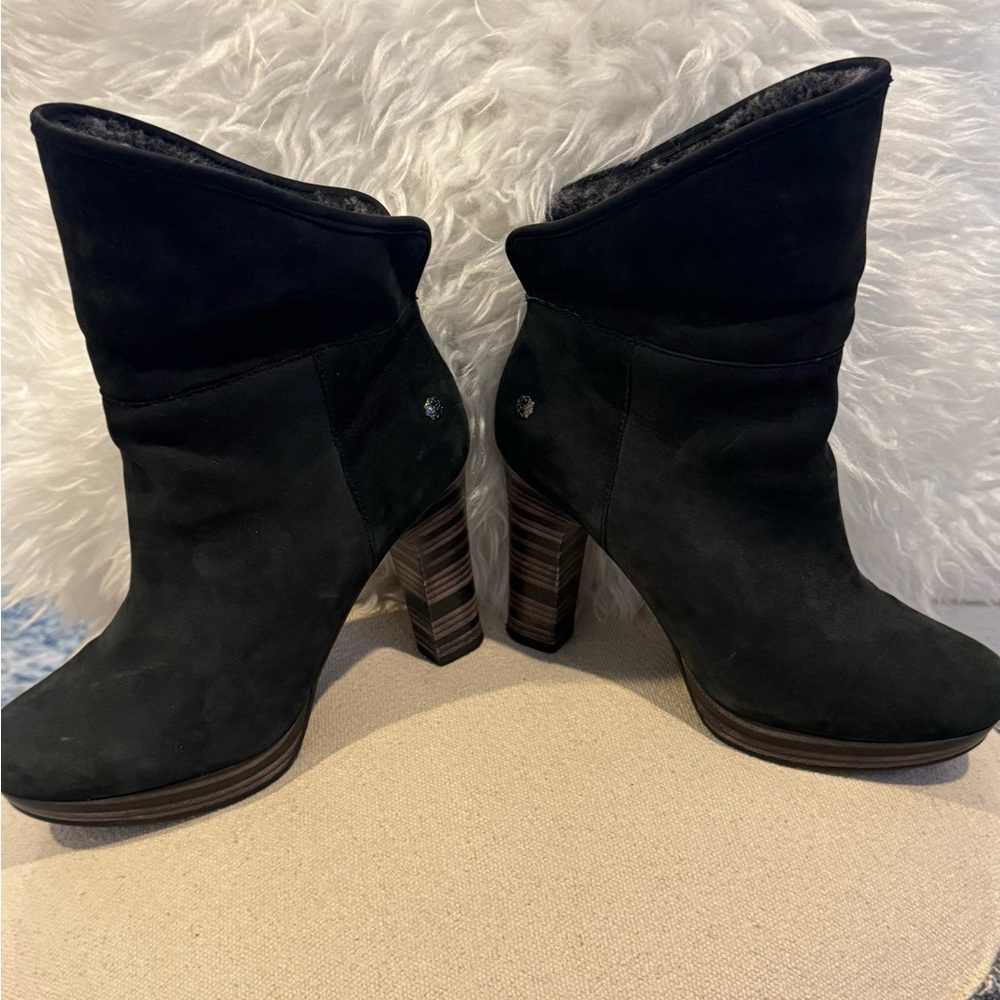Size 7 women’s UGG high heeled boots.  Wear leather top up or down for style.